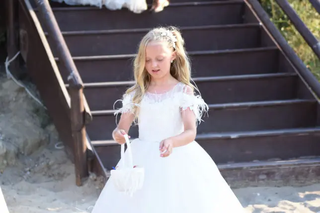 Brides maid dropping flowers